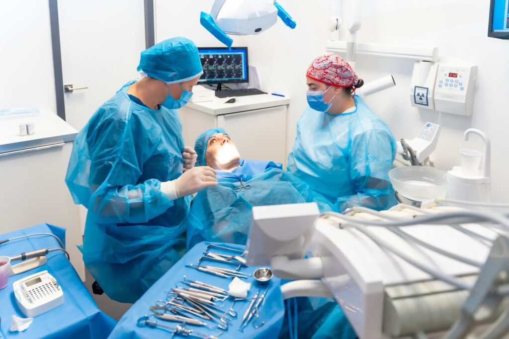 Dental clinic, dentist doctor with the assistant preparing all the utensils before the operation